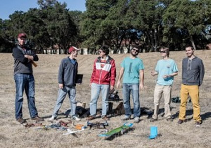 Three teams of Stanford students build their unmanned aerial vehicles and then used them to find four objects in an empty field in a timed competition.