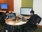  A tutor helps students with an assignment in the CIS Sandbox.