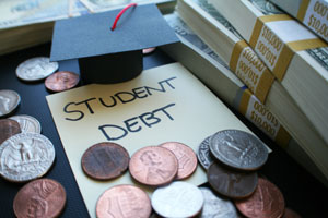 student debt note with coins, bills and graduation cap