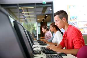 college students working on desktop computers