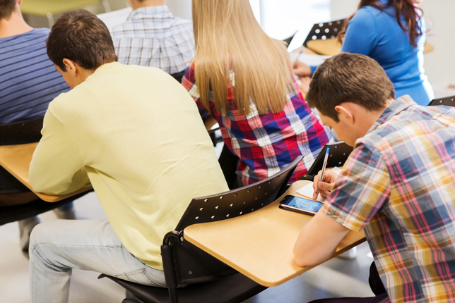 students using cell phones in class