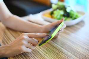 woman placing a food order on mobile phone