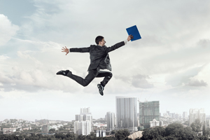 young businessman flying through air