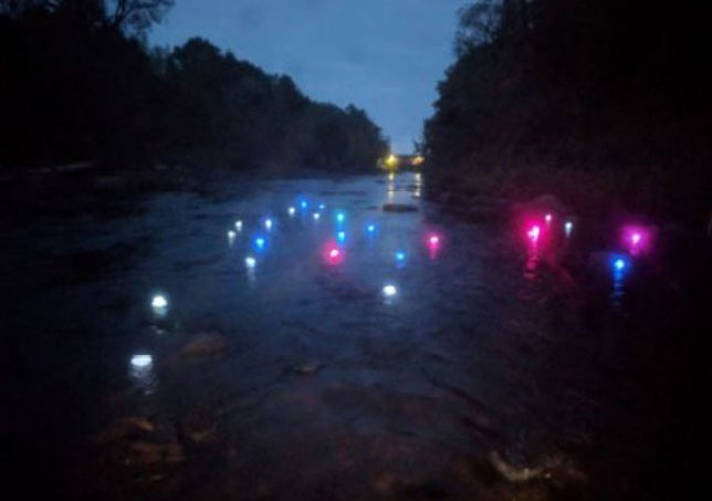 3D-printed LED-lighted vessels floating down the Grasse River in northern New York. When they reached a particular location, they automatically changed color to green.