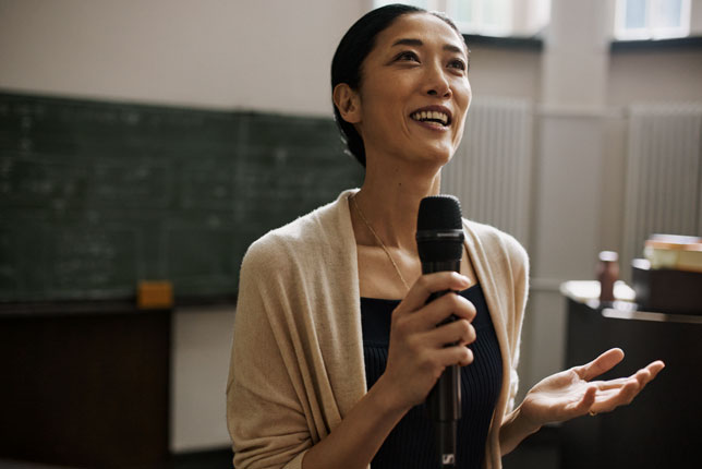 woman speaking into microphone