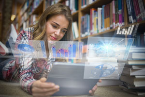 college student lying on library floor using tablet