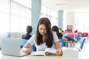 student studying with laptop