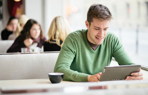 student studying with tablet