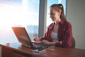 student studying on laptop