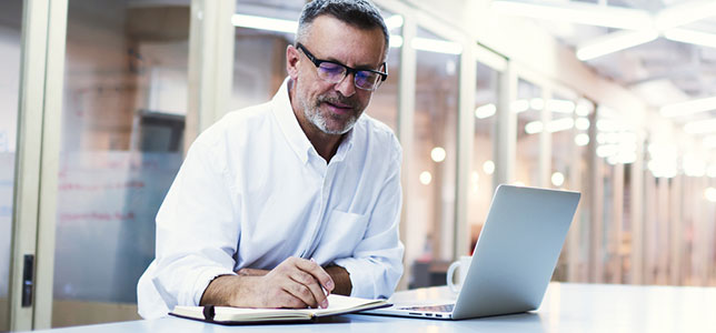 professor working on laptop