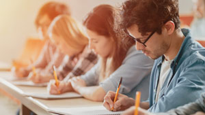 row of college students taking a test