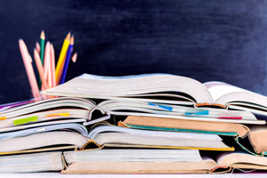 stack of open textbooks