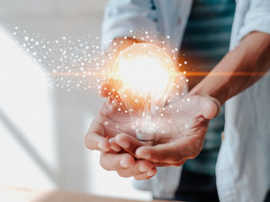 man holding lightbulb