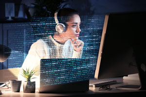 Young woman working with computer at table