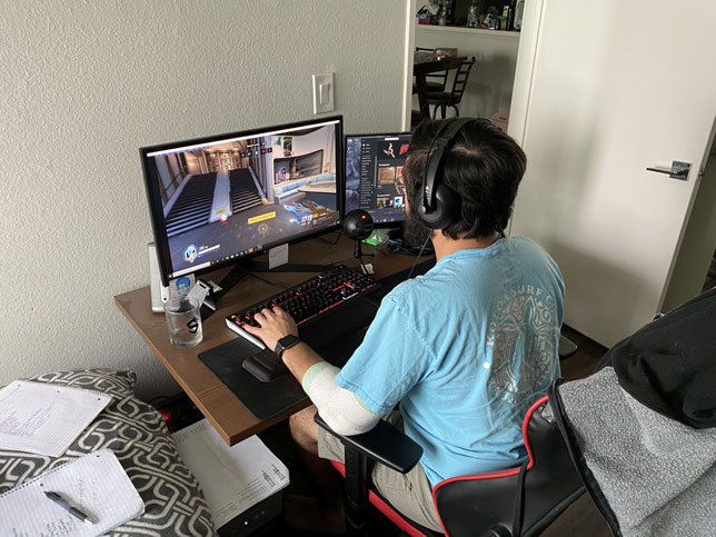 UCLA esports varsity player Naveen Sheik plays on the Overwatch team from his room during the COVID-19 pandemic