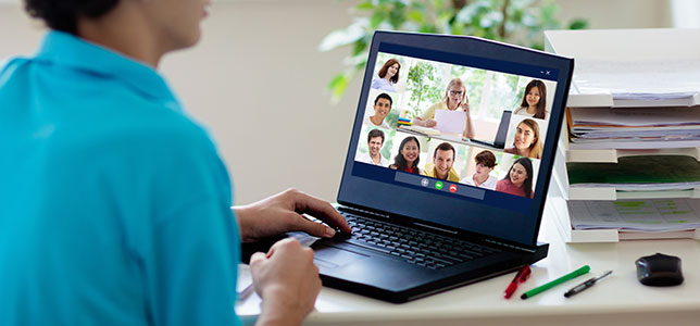 closeup of laptop with videoconference on screen