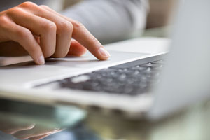 closeup of hand on laptop