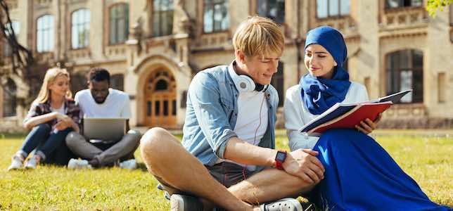 college students sitting outdoors