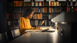 college student studying in library