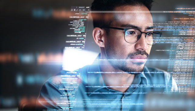 man viewing holographic display of data and code
