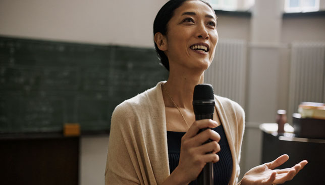woman speaking into microphone