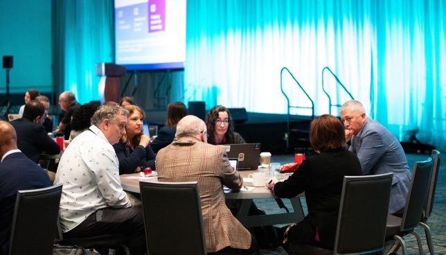 Dana Brunson facilitates a roundtable discussion with research and higher education IT leaders