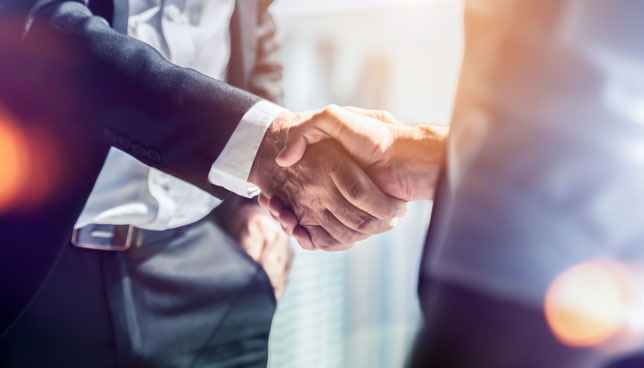 two businessmen shaking hands