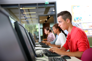 college students working on desktop computers