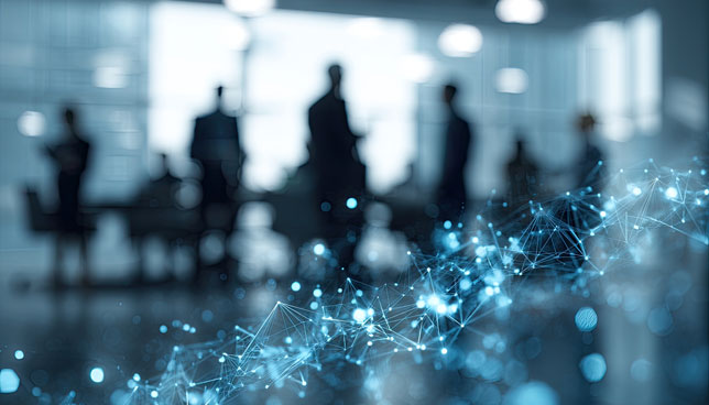 Blurred silhouettes of business people in a modern office with a glowing blue network overlay
