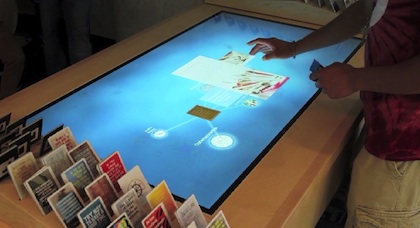 When prospective students place cards on Trinity University's MultiTaction table an application displays potential areas of study, on-campus resources and related multimedia, such as images and videos.