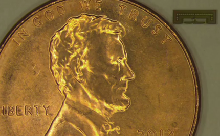 The radio chip designed at Stanford University is so small it's dwarfed by a penny.