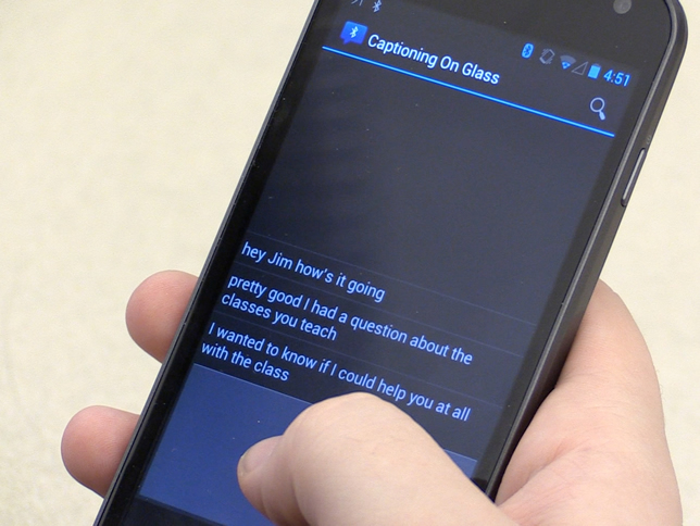 Captioning on Glass allows a person to speak into a phone. The text then shows up on Google Glass. Image courtesy of Georgia Tech.