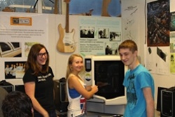From left, Colfax High School students Autumn Turner, Hailey Elias and Alec Cobabe have invented a ski sensor and are learning product design as part of a community college STEM initiative.